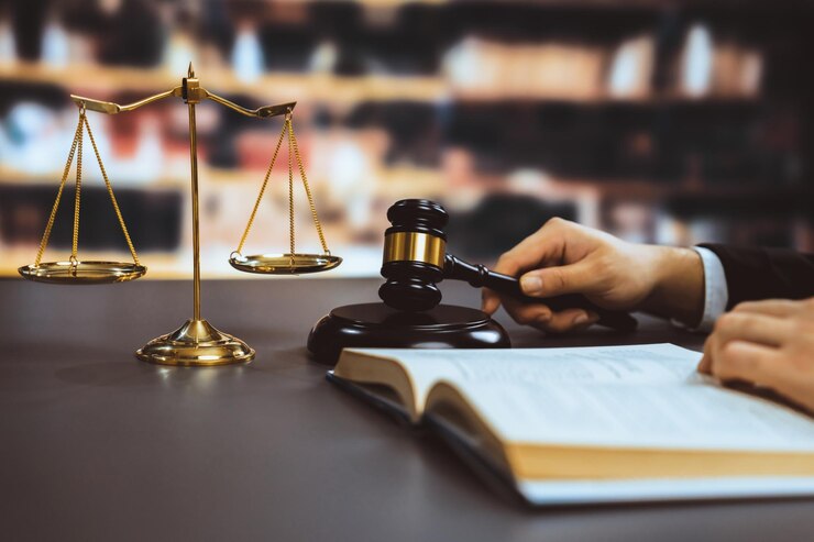 closeup-lawyer-reading-studying-legal-book-library-equilibrium_31965-166844